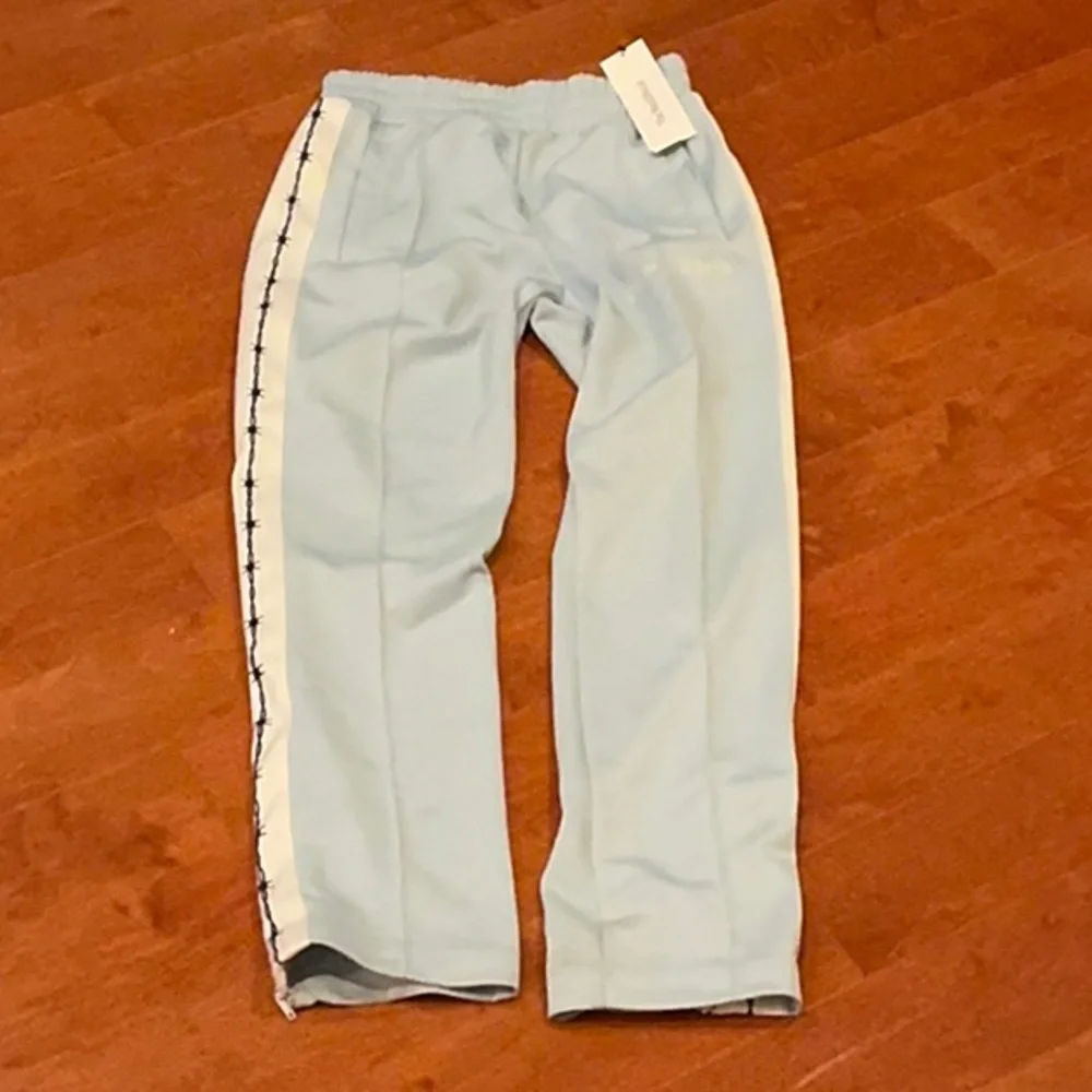 Palm Angels mens Sky Blue Joggers with White Stripes